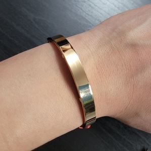 Gold bar bracelet, orange leather strap.